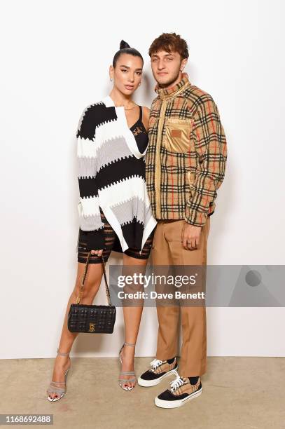 Dua Lipa and Anwar Hadid attend the Burberry September 2019 show during London Fashion Week, on September 16, 2019 in London, England.