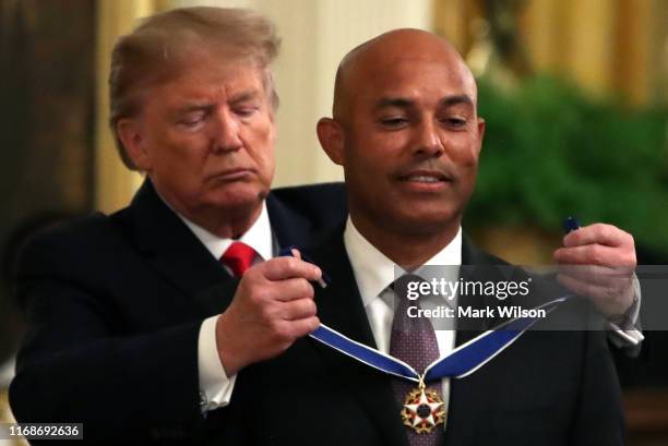 President Donald Trump presents the Presidential Medal of Freedom to former New York Yankees player Mariano Rivera in the East Room of the White...