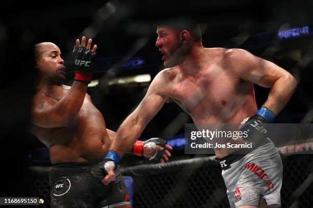 Stipe Miocic throws a punch at Daniel Cormier in the second round during their UFC Heavyweight Title Bout at UFC 241 at Honda Center on August 17,...