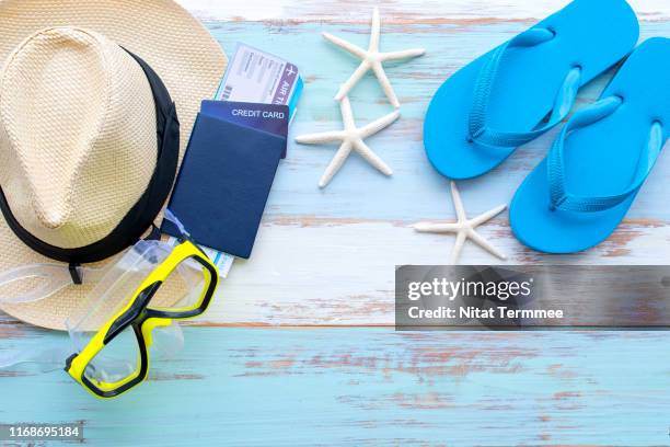 travel accessories costumes. passport and flight tickets. the cost of travel prepared for the summer trip. travel accessories costumes. passport and flight tickets. the cost of travel prepared for the summer trip. diving trips concept. - travel bagpack stock pictures, royalty-free photos & images