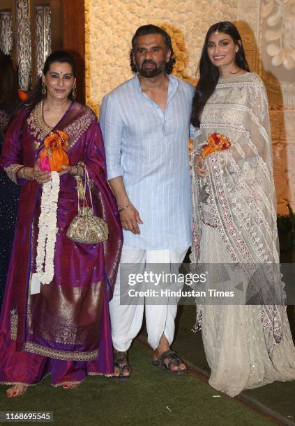 Bollywood actor Suniel Shetty along with wife Mana Shetty and daughter Athiya Shetty during the Ganesh Chaturthi celebrations at the residence of...