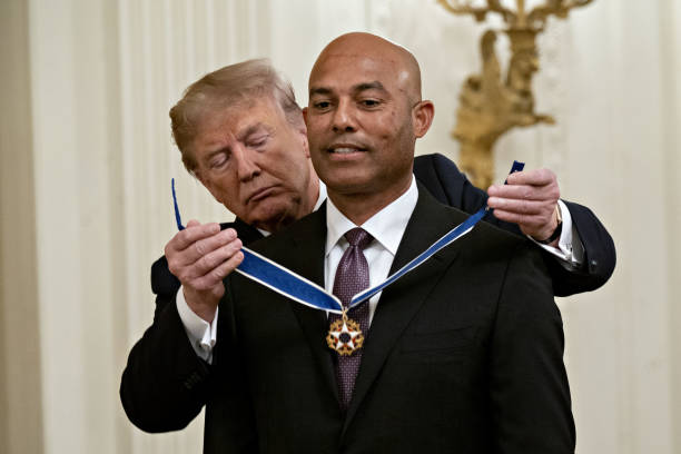 President Donald Trump, left, presents the Presidential Medal of Freedom to Mariano Rivera in the East Room of the White House in Washington, D.C.,...