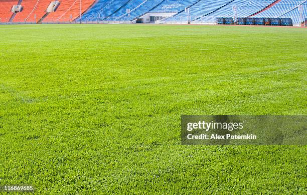 green field for playing sports - tribune tower stock pictures, royalty-free photos & images