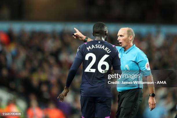 Match referee Mike Dean orders Arthur Masuaku of West Ham United to leave the field after picking up a second Yellow card during the Premier League...