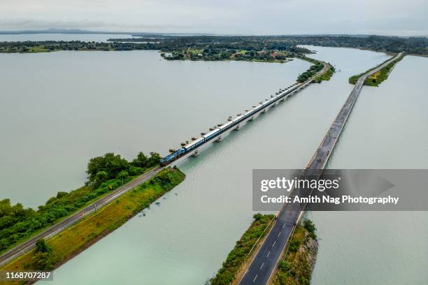 an early morning train crossing the sagarakatte bridge, karnataka, india - bridge stock photos et images de collection