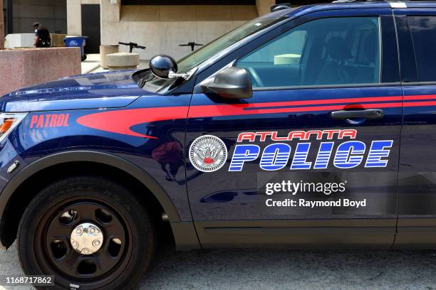 An Atlanta police vehicle sits parked outside State Farm Arena in Atlanta, Georgia on July 28, 2019.