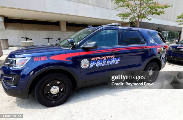 An Atlanta police vehicle sits parked outside State Farm Arena in Atlanta, Georgia on July 28, 2019.