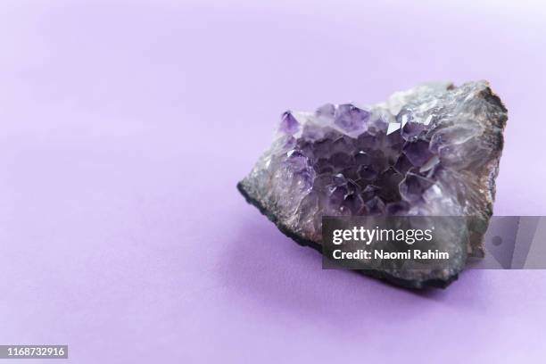 close up of amethyst crystal geode on a puple background - アメジスト ストックフォトと画像