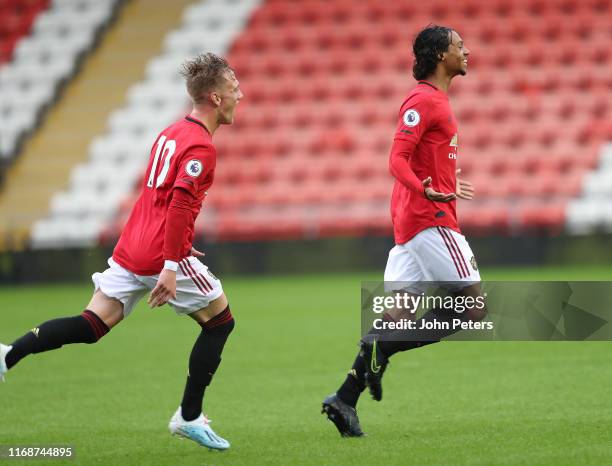 Mani Bughail-Mellor of Manchester United celebrates scoring their first goal during the Premier League 2 match between Manchester United U23s and...