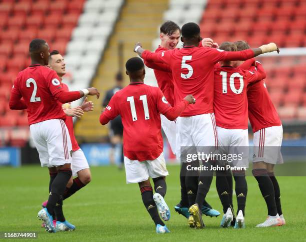 Mani Bughail-Mellor of Manchester United celebrates scoring their first goal during the Premier League 2 match between Manchester United U23s and...