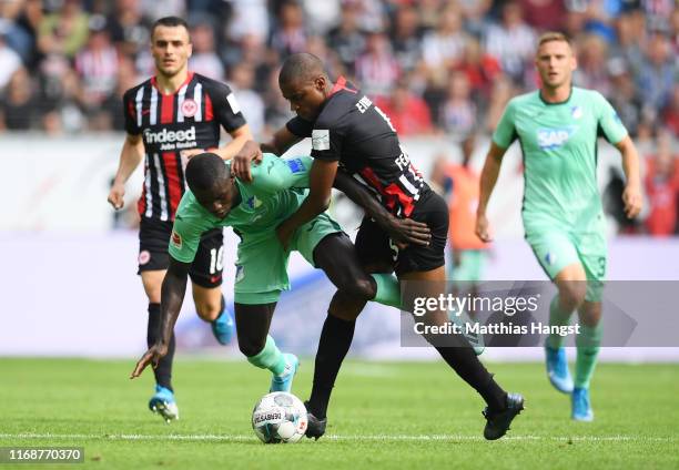 Ihlas Bebou of TSG 1899 Hoffenheim and Gelson Fernandes of Eintracht Frankfurt battle for the ball during the Bundesliga match between Eintracht...