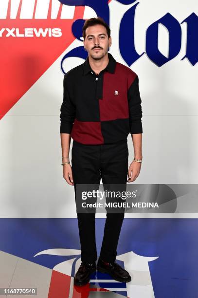 Italian fashion blogger Roberto De Rosa poses during the presentation of the Fall 2019 'Tommy X Lewis' collection, a collaboration between US...