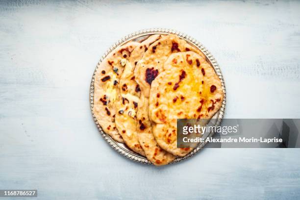 indian food: naan bread dish with butter - naan stock pictures, royalty-free photos & images