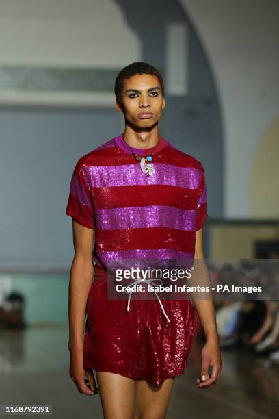 Models on the catwalk at the Ashish Spring/Summer 2020 London Fashion Week at Seymour Hall in London.