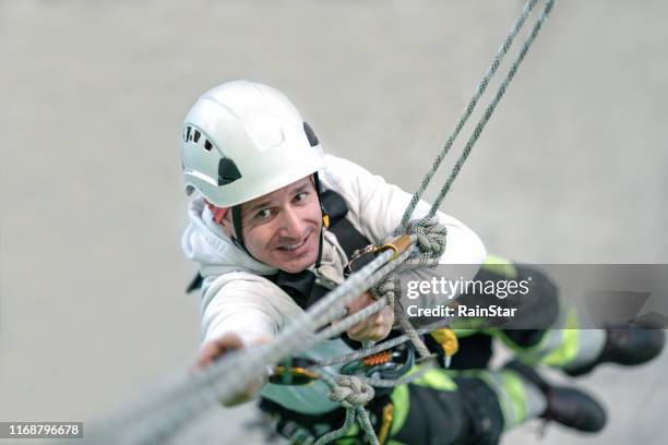 rope access irata worker - rope high rescue stock pictures, royalty-free photos & images