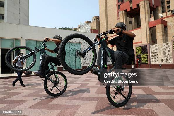 Riders try out the Hero Motors Lectro EHX20 e-bike during a