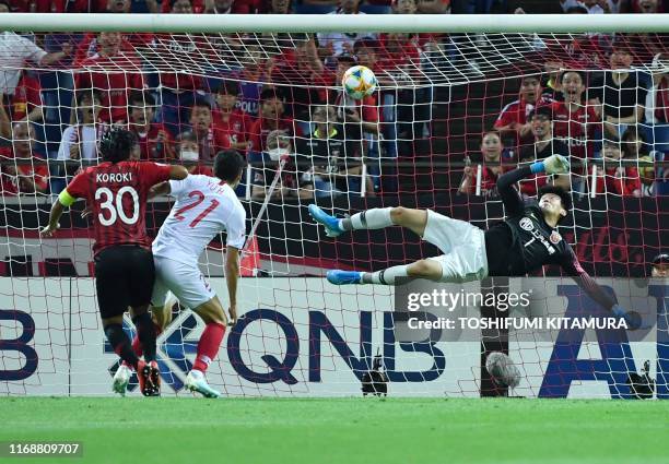 Urawa Reds forward Shinzo Koroki shoots to score a goal during the AFC Champions League football quarter-finals second leg match between Urawa Reds...