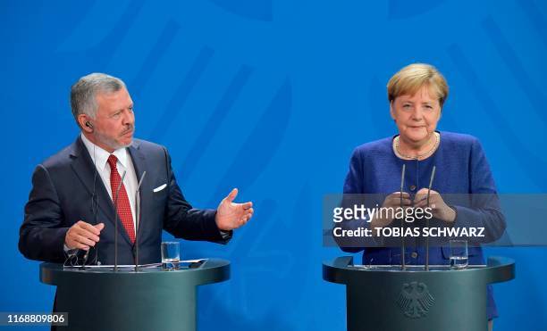 German Chancellor Angela Merkel and King Abdullah II of Jordan give a joint press conference following talks on economic issues and the bilateral...