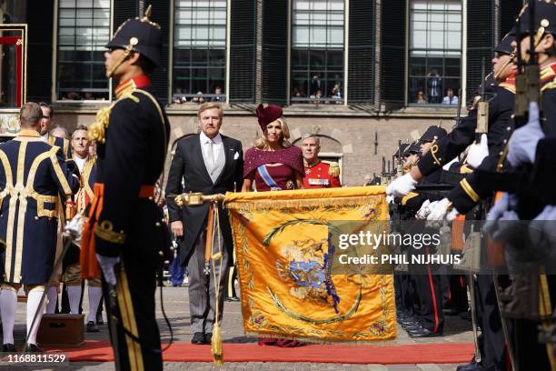 King Willem-Alexander and Queen Maxima greet the royal banner, during their arrival at the Ridderzaal during Prinsjesdag in The Hague, on September...