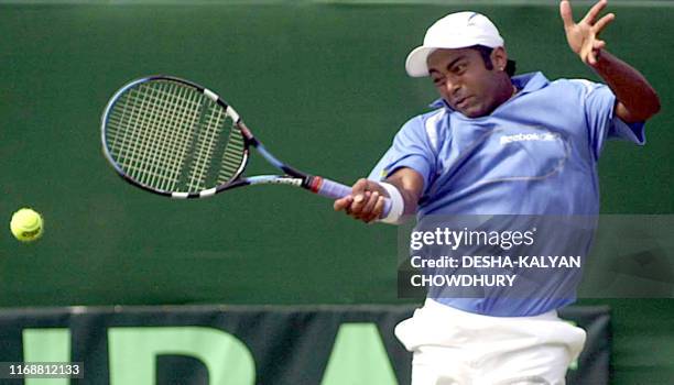 India's Leander Paes hits a return to Robert Cheyne of New Zealand during their singles Davis Cup match in Calcutta, 06 April 2003. Paes won 6-2,...