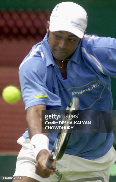 Indian tennis player Leander Paes hits a backhand during his singles Davis Cup match against Mark Nielsen of New Zealand in Calcutta 04 April 2003....