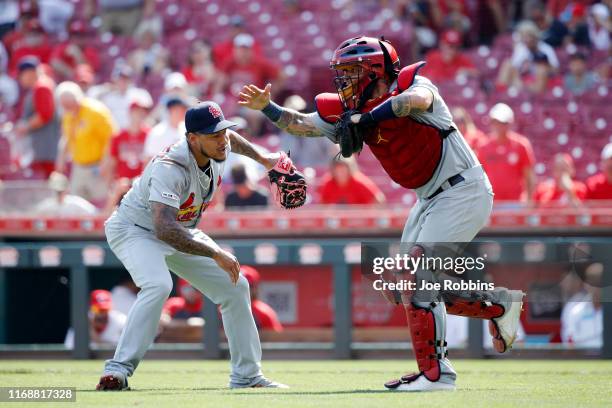 Carlos Martinez and Yadier Molina of the St. Louis Cardinals celebrate after the final out in the ninth inning against the Cincinnati Reds at Great...