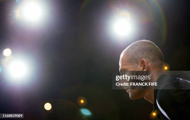 French captain Guy Forget watches the Davis cup final double match between France's Nicolas Escude/Fabrice Santoro and Russia's Marat Safin/Yevgeny...