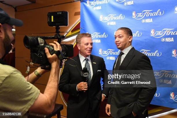 Cleveland Cavaliers broadcaster Fred McLeod interviews Tyronn Lue in Game Four of the 2017 NBA Finals on June 9, 2017 at Quicken Loans Arena in...