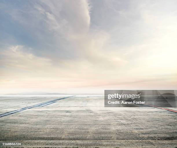 horizon over tarmac lot - airport tarmac stock pictures, royalty-free photos & images