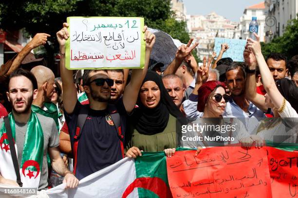 Algerian protesters carrying national flags chanted slogans during the student demonstration in Algiers, Algeria on September 17, 2019. - Algeria...