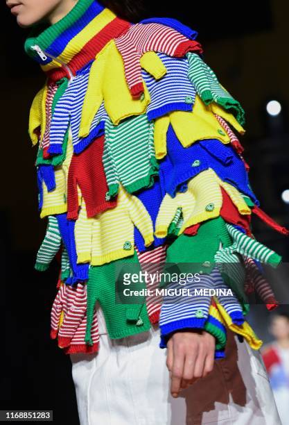 Model presents a creation for Benetton during the Women's Spring-Summer 2020 collection fashion show, on September 17, 2019 in Milan.