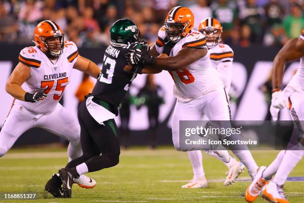 Cleveland Browns offensive tackle Greg Robinson blocks New York Jets linebacker Blake Cashman during the National Football League game between the...