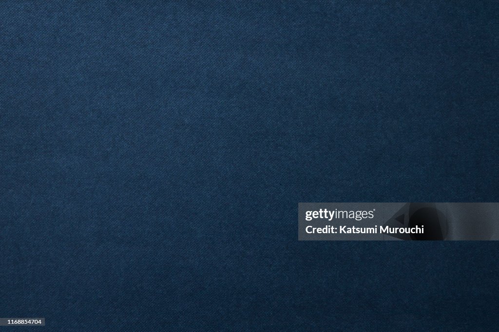 Navy color spotted paper texture background