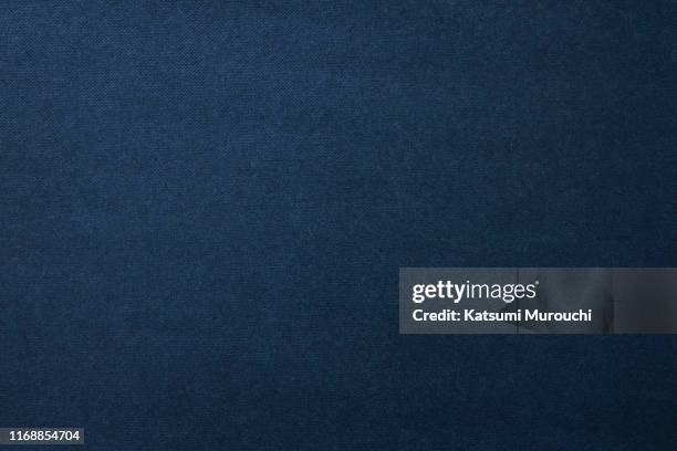 navy color spotted paper texture background - dark blue background texture fotografías e imágenes de stock