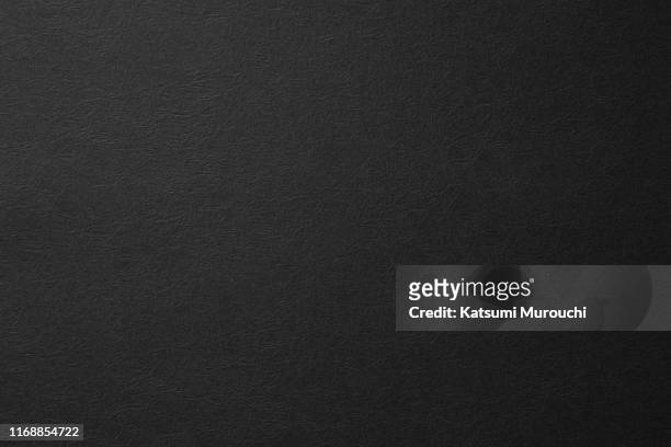 winkled black paper texture background - colore nero foto e immagini stock