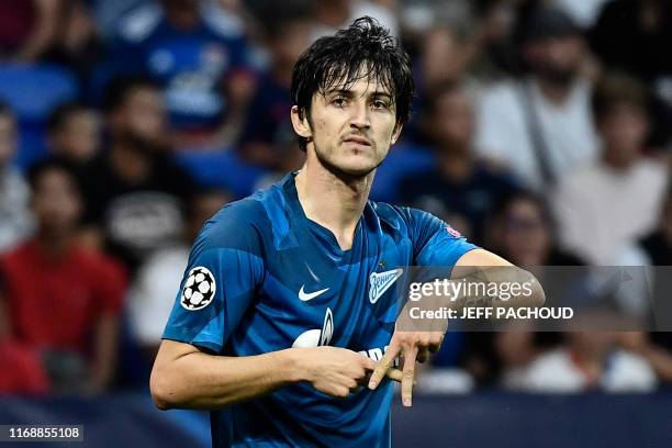 Zenit St. Petersburg's Iranian forward Sardar Azmoun celebrates after scoring a goal during the European Champions League football match between...