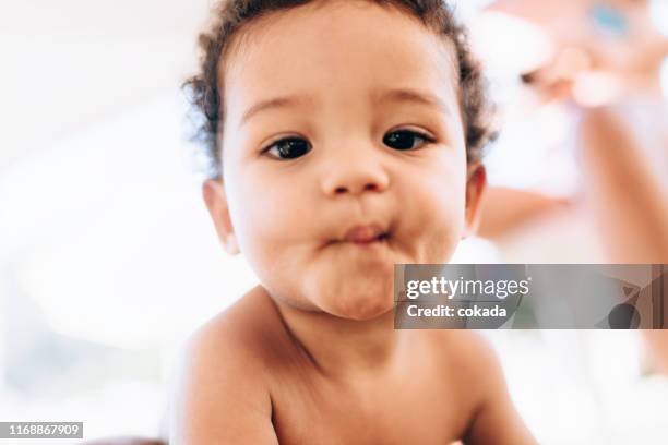 portrait of a african descendant baby looking at camera - cute babies stock pictures, royalty-free photos & images