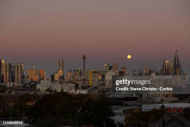 Full moon rises over Sydney's CBD shot from Rozelle on August 15, 2019 in Sydney, Australia.