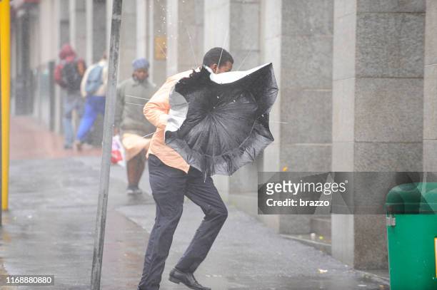 brocken paraplu - broken umbrella stockfoto's en -beelden
