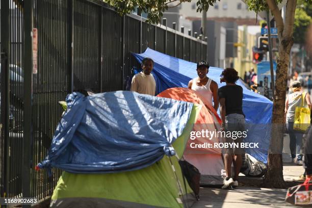 Tents line the street in Skid Row in Los Angeles, California on September 17, 2019. - US President Donald Trump has indicated he plans to address the...