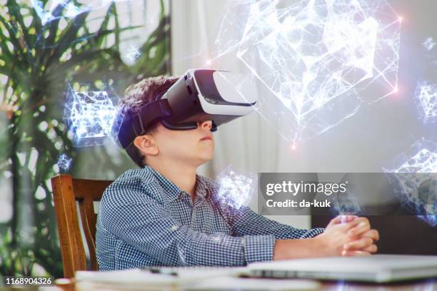 a boy in virtual glasses learning geometric shapes holograms. - holograma imagens e fotografias de stock