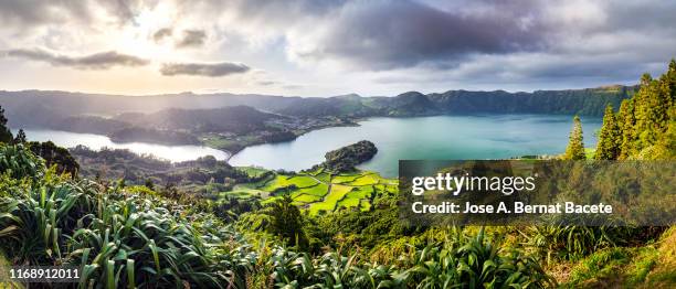 landscape of tropical rainforest with a lake in spring in sao miguel island in the azores islands, portugal. - the azores stock-fotos und bilder