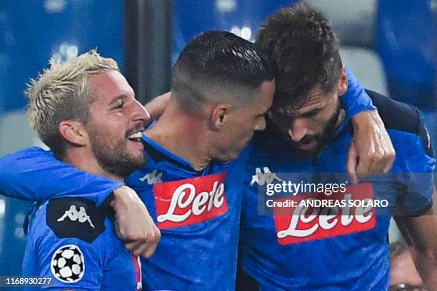 Napoli's Belgian forward Dries Mertens celebrates with Napoli's Spanish forward Jose Callejon and Napoli's Spanish forward Fernando Llorente after...