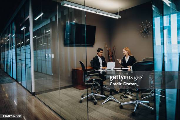 cuban and mexican business people using internet for business correspondence and analysis. - bankers imagens e fotografias de stock