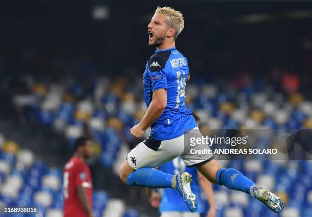 Napoli's Belgian forward Dries Mertens celebrates after scoring a penalty during the UEFA Champions League Group E football match Napoli vs Liverpool...