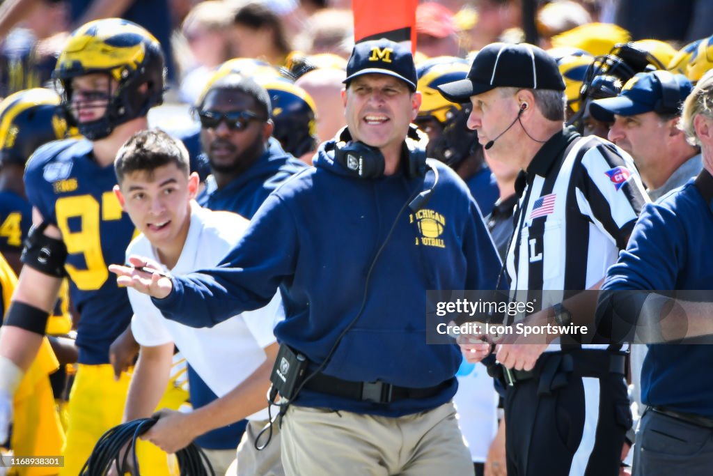 Michigan Wolverines head coach argues with a referee during the... News