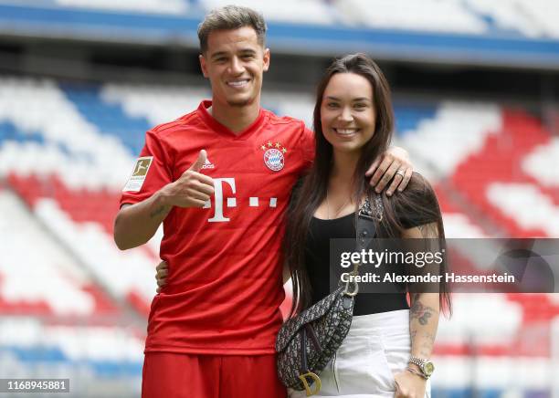 Newly signed Player of FC Bayern Muenchen Philippe Coutinho and his wife Aine Coutinho pose for a picture during his official presentation at Allianz...