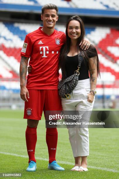 Newly signed Player of FC Bayern Muenchen Philippe Coutinho and his wife Aine Coutinho pose for a picture during his official presentation at Allianz...