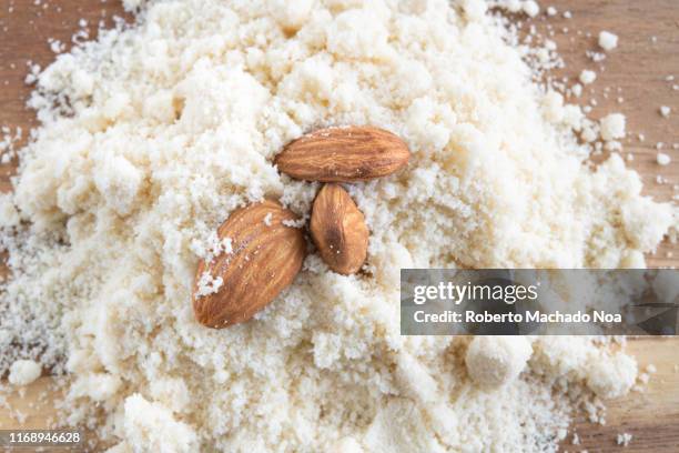 almond flour with three nuts on top - chopping block flour stock pictures, royalty-free photos & images