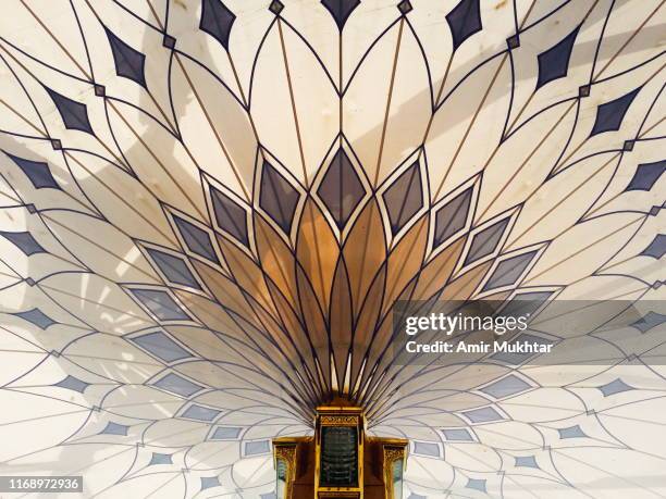 big huge umbrellas in the courtyard of the prophet mosque - saudi arabia imagens e fotografias de stock